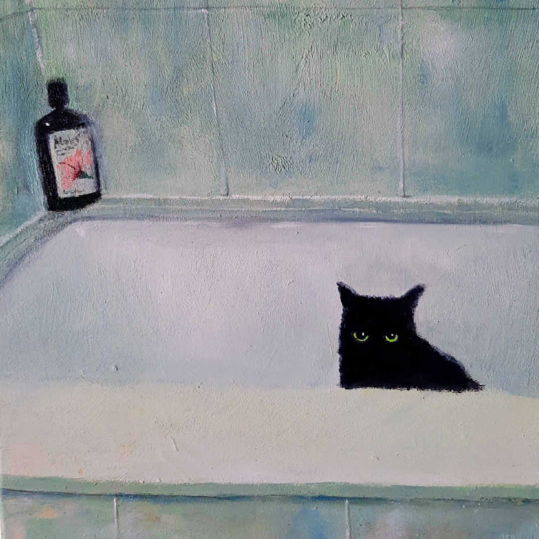 Black cat peering over the edge of a green-tiled bathtub
